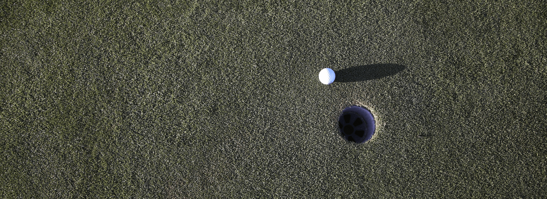 Golf ball near hole